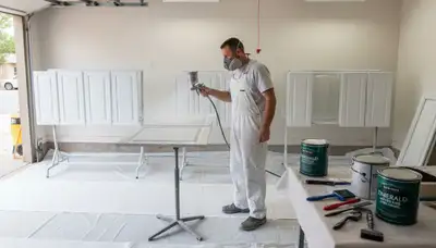 Professional cabinet painting process in Colorado Springs, CO showing smooth sprayed kitchen finish